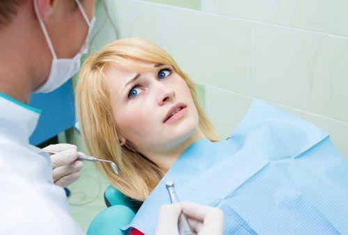 blonde woman frightened in dental chair | sedation dentistry medina oh