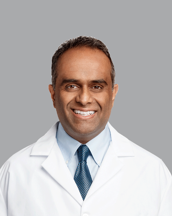 headshot of dr karunagaran | prosthodontist cleveland